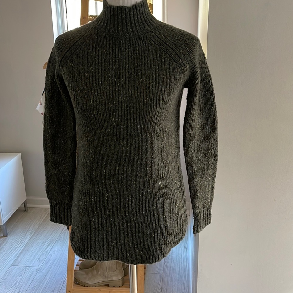 Cynthia Rowey• Green sweater